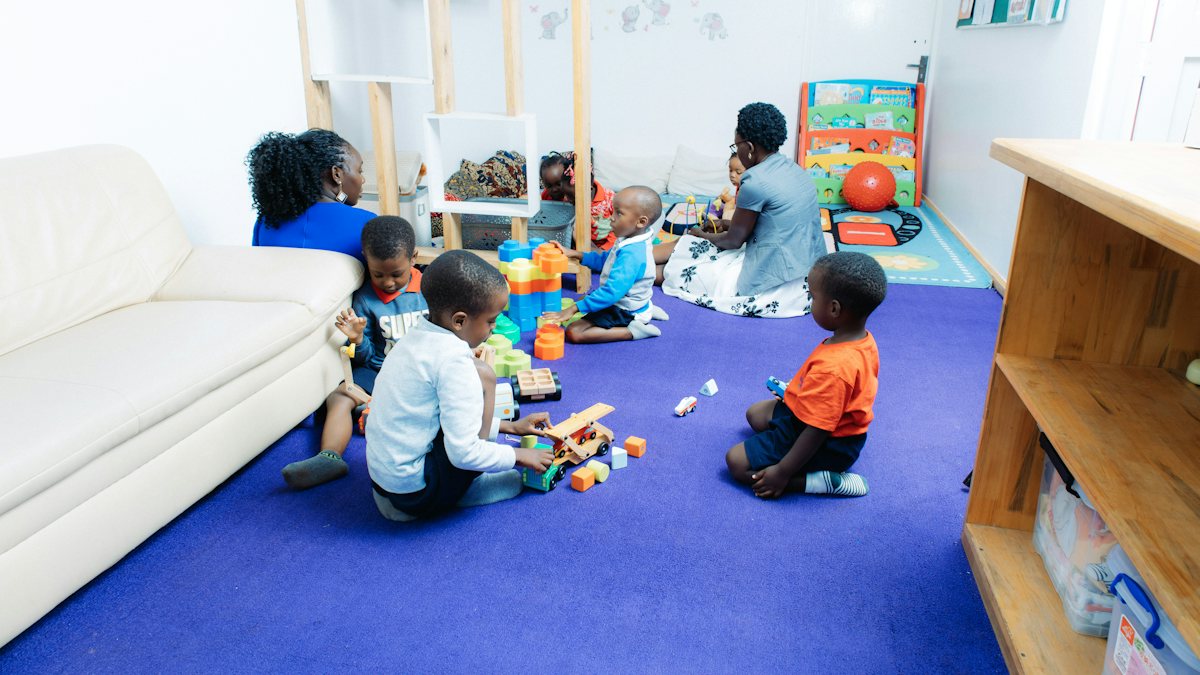 Children playing with toys in a bright room