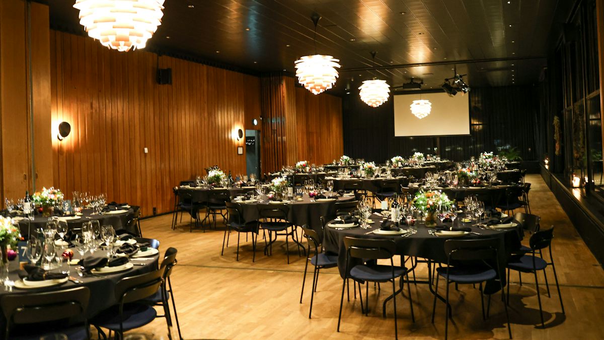An event space set with round dining tables