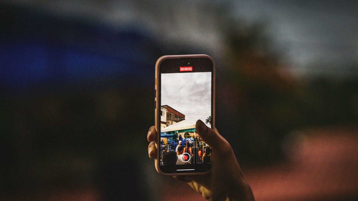 Someone filming with a smartphone