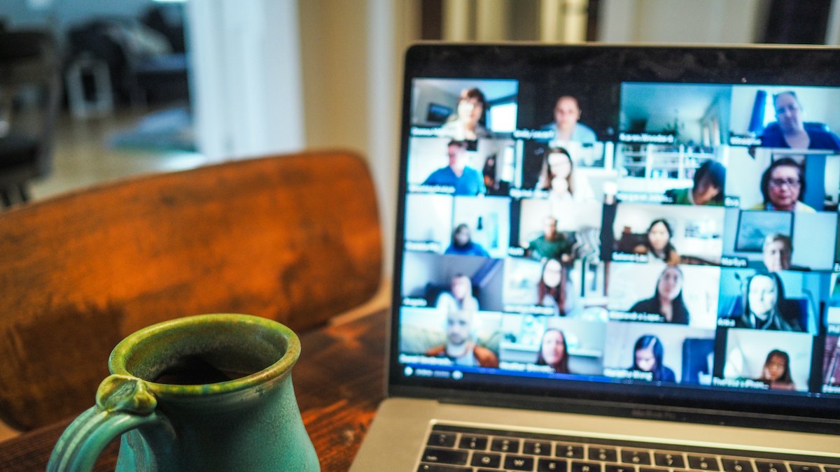 A laptop showing a group video call